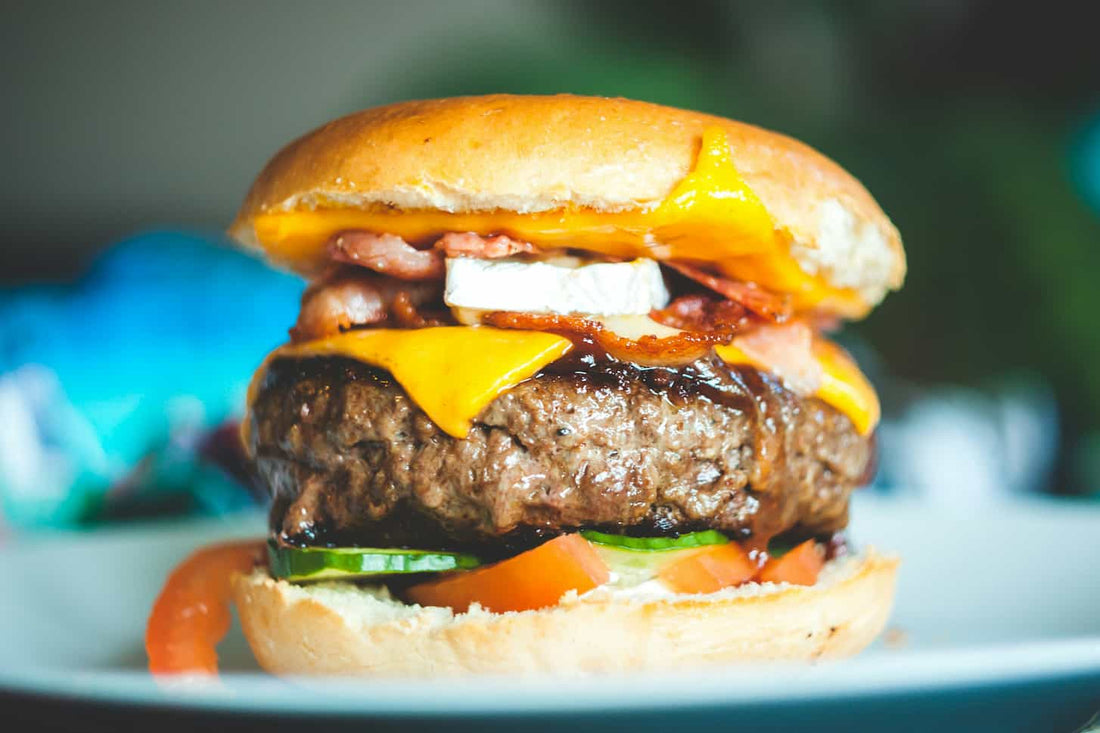 close up photo of burger with grinded meat slice