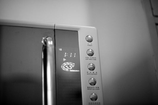 black and white photo of a microwave oven